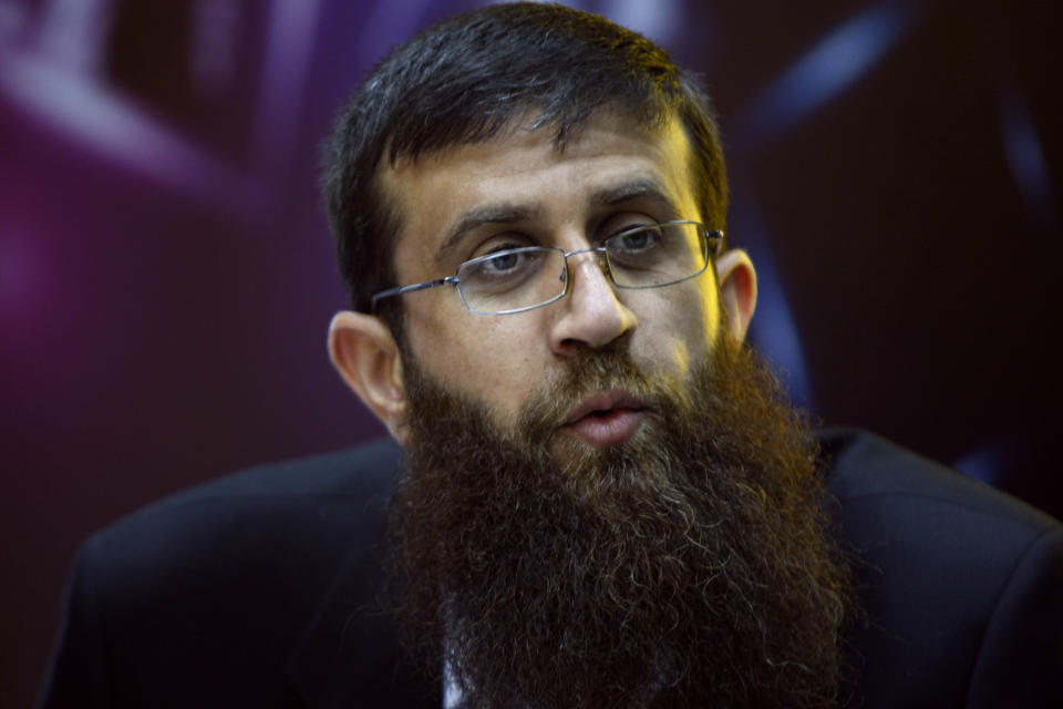 FILE - Palestinian Khader Adnan, an Islamic Jihad spokesman who went on a 66-day hunger strike while he was imprisoned in an Israeli jail, speaks during a television interview in the West Bank city of Ramallah, May 6, 2012. Palestinian prisoner Adnan died in Israeli custody early Tuesday, May 2, 2023, after a hunger strike of nearly three months, Israel’s prison service announced. (AP Photo/Majdi Mohammed, File)