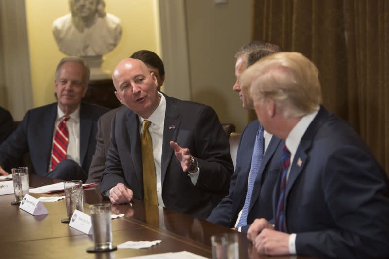 Then-Gov. Pete Ricketts, R-Neb., speaks during a meeting on trade with then-President Donald Trump with other governors and members of Congress at the White House in April 2018. File Photo by Chris Kleponis/UPI