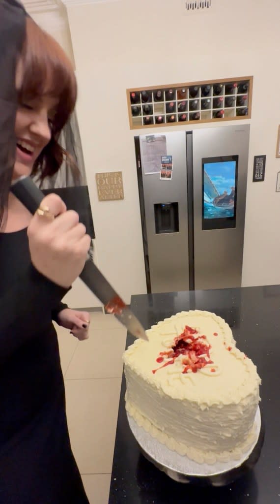 She cut into a Taylor Swift-inspired blood cake. @MrsKateTampion / CATERS NEWS