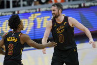 Cleveland Cavaliers' Kevin Love, right, celebrates with Collin Sexton after Sexton scored during the second half of the team's NBA basketball game against the Boston Celtics, Wednesday, May 12, 2021, in Cleveland. The Cavaliers won 102-94. (AP Photo/Tony Dejak)