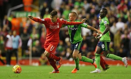 Football - Liverpool v Southampton - Barclays Premier League - Anfield - 25/10/15 Liverpool's Roberto Firmino in action with Southampton's Jordy Clasie Action Images via Reuters / Alex Morton Livepic