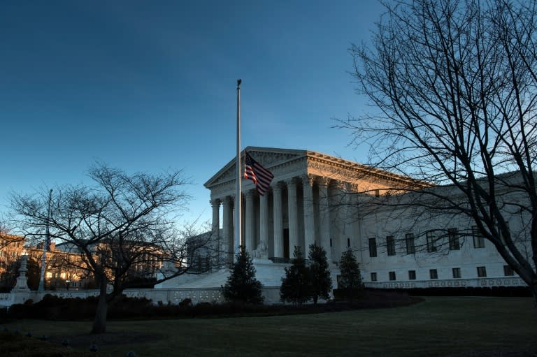 The flag flies at half-staff at the US Supreme Court on February 14, 2016 in Washington
