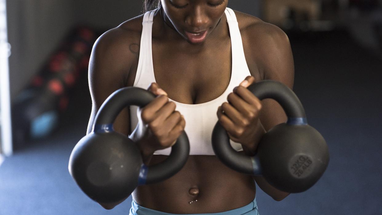 woman-doing-kettlebell-compound-exercises