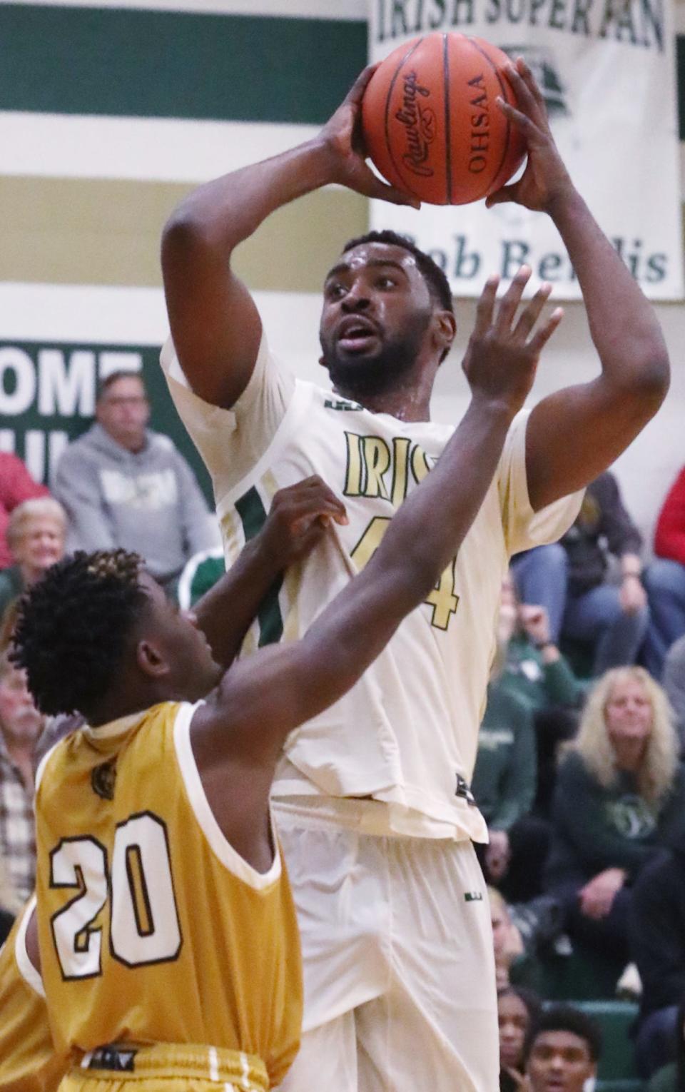 St. Vincent-St. Mary's John Whorton looks to shoot over South Oak Cliff's Ricky Giles Jr. at STVM on Jan. 4.