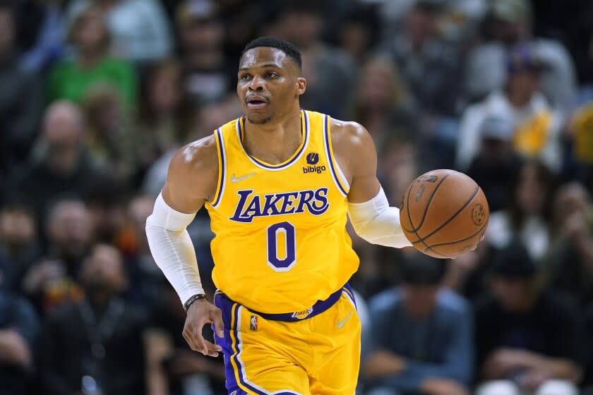 Lakers guard Russell Westbrook brings the ball up during a game against the Jazz