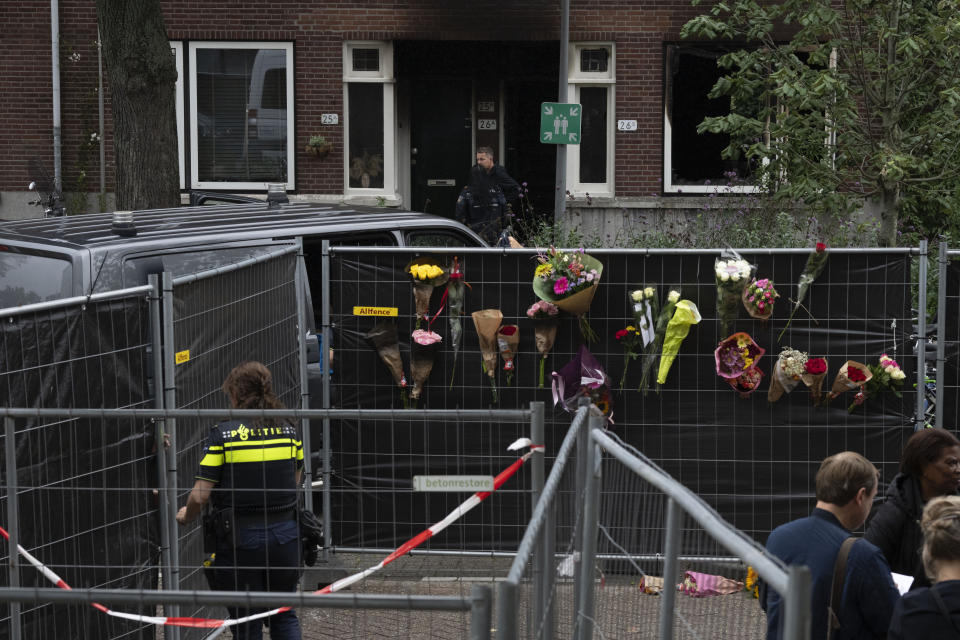 Police officers are seen at the scene of a shooting in Rotterdam, Netherlands, Friday, Sept. 29, 2023. Police in the Netherlands said a lone gunman wearing a bulletproof vest opened fire in an apartment and a hospital in the Dutch port city of Rotterdam, Thursday, Sept. 28, 2023, killing three people, including a 14-year-old girl. (AP Photo/Peter Dejong)