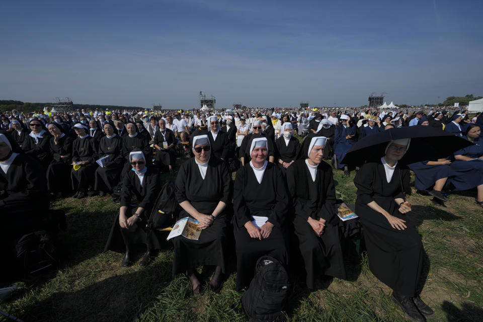 Nuns attend a Mass celebrated by Pope Francis in the esplanade of the National Shrine in Sastin, Slovakia, Wednesday, Sept. 15, 2021. Pope Francis celebrated an open air Mass in Sastin, the site of an annual pilgrimage each September 15 to venerate Slovakia's patron, Our Lady of Sorrows. (AP Photo/Petr David Josek)