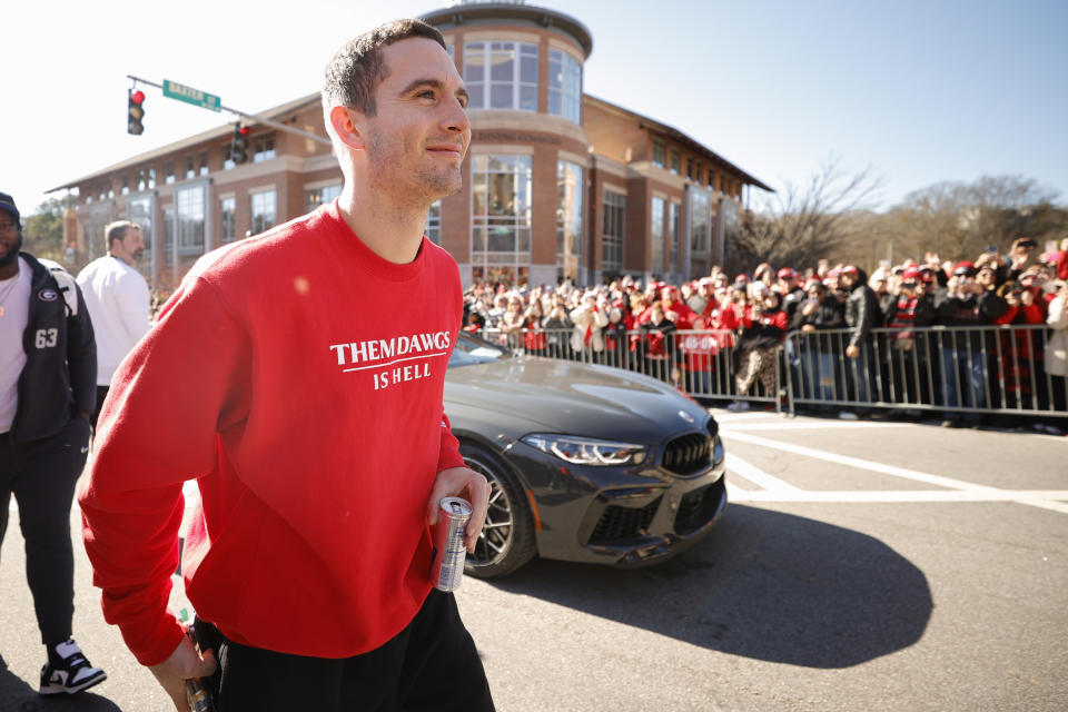 Georgia quarterback Stetson Bennett walks the route during a parade celebrating the Bulldog's second consecutive NCAA college football national championship, Saturday, Jan. 14, 2023, in Athens, Ga. (AP Photo/Alex Slitz)