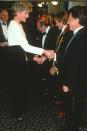 <p>At the premiere of <em>Hook </em>in 1992, the actor wore a standard tuxedo. Princess Diana marked the occasion with a white beaded and black velvet gown by Catherine Walker. </p>