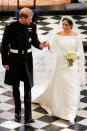 <p>The Duchess of Sussex was truly a regal vision on her wedding day in a striking boatneck Givenchy couture gown by Clare Waight Keller. The gorgeous cathedral-length veil carried symbolic meaning, as Waight Keller captured the flora of 53 Commonwealth countries with beautiful embroidery.</p>