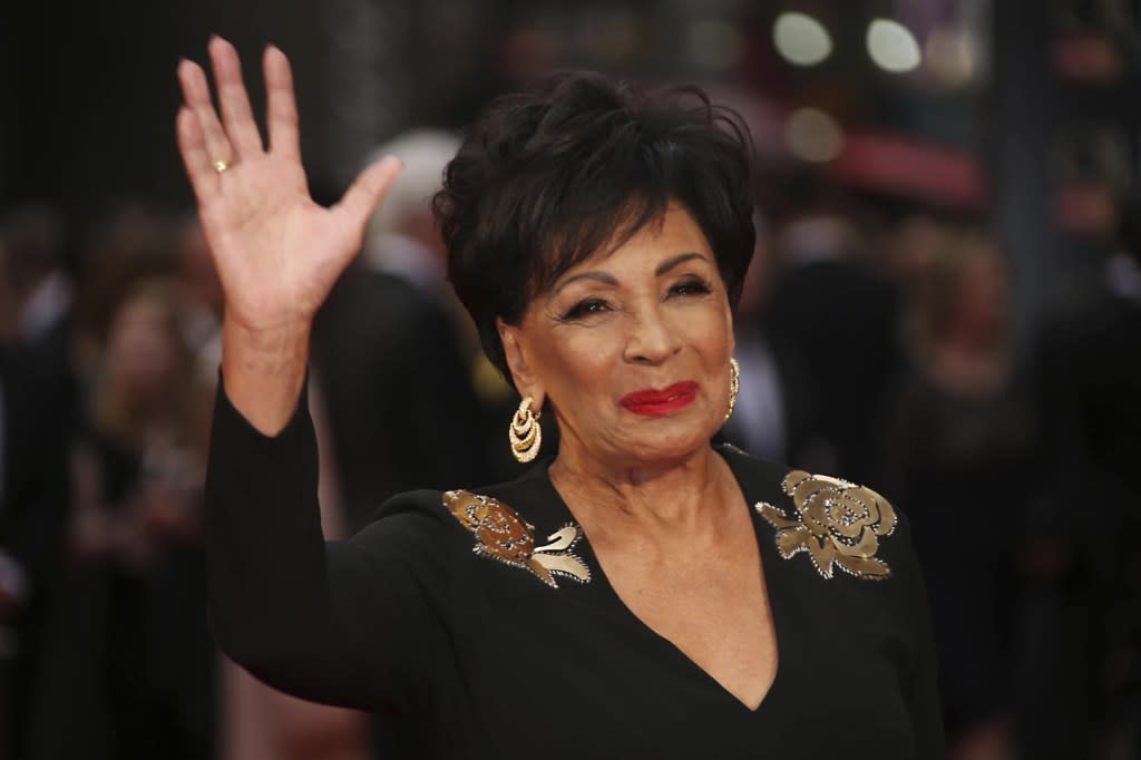 Dame Shirley Bassey poses for photographers upon arrival at the Olivier Awards in London, Sunday, April 3, 2016. (Photo by Joel Ryan/Invision/AP, File)