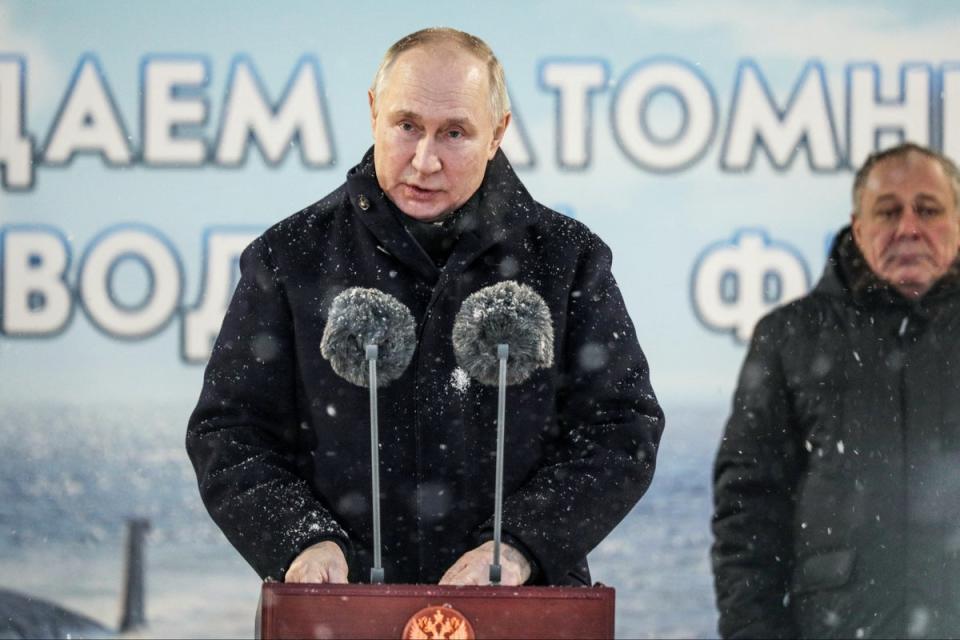 Russian President Vladimir Putin delivers his speech as he attends a flag-raising ceremony for newly-built nuclear submarines at the Sevmash shipyard today (AP)