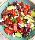 <p>This Greek-inspired tomato salad is packed with fresh veggies and flavor-boosting ingredients, like balsamic vinegar, Kalamata olives and crumbled feta cheese. This delicious salad takes just 15 minutes to make and while you could eat it right away, it tastes even better the longer it sits, so plan to leave at least an hour of marinating time before serving. <a href="https://www.eatingwell.com/recipe/7909606/cucumber-tomato-feta-salad-with-balsamic-dressing/" rel="nofollow noopener" target="_blank" data-ylk="slk:View Recipe" class="link ">View Recipe</a></p>