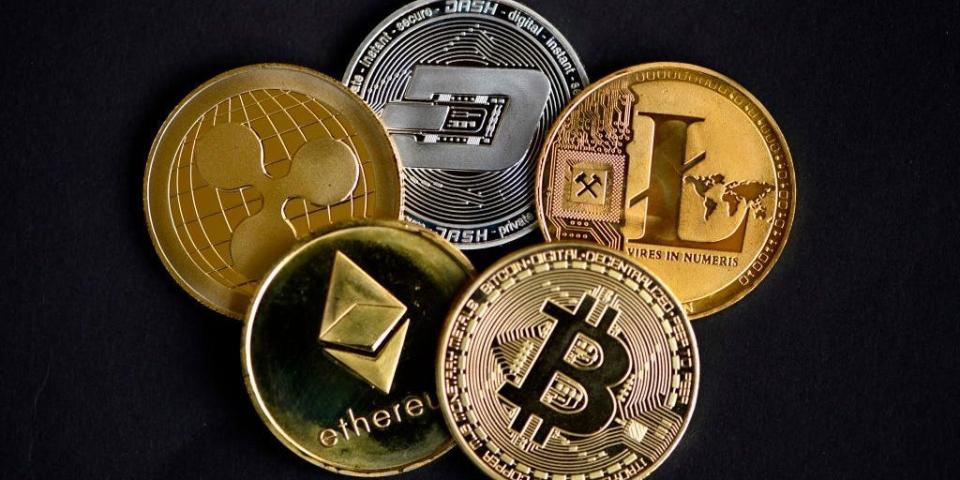 The photo shows physical imitations of cryptocurrency