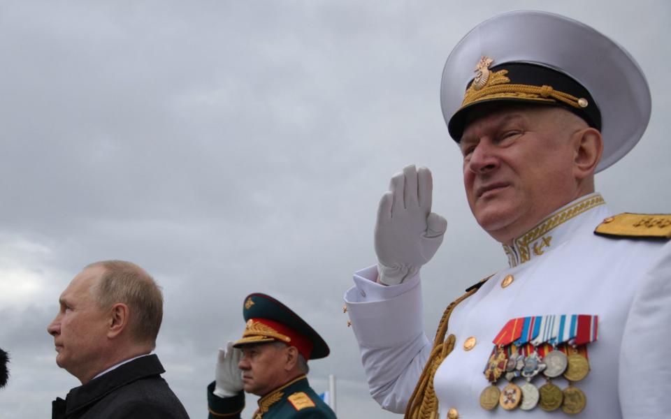 Russia's President Vladimir Putin (L) stands next to Russia's Defence Minister Sergei Shoigu (C) and former Commander-in-Chief of the Russian Navy, Admiral Nikolai Yevmenov (R), in happier times. Admiral Yevmenov has reportedly been dismissed