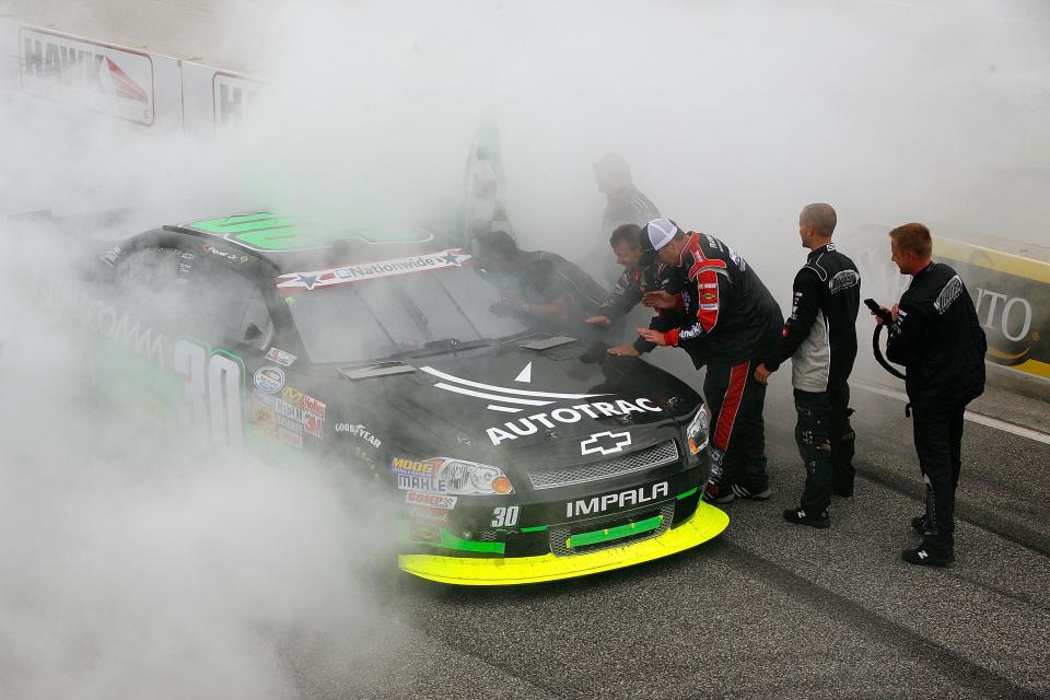 Nelson Piquet Jr. celebrates with a burnout after winning the 2012 Sargento 200.