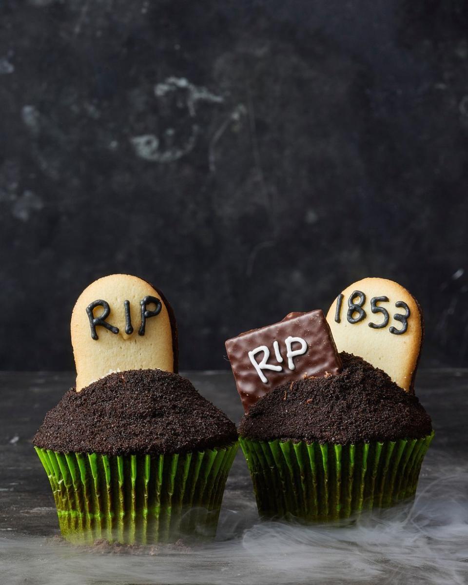 <p>Graveyard cookies are best when buried deep in delicious Oreo-covered <a href="https://www.goodhousekeeping.com/food-recipes/a28566700/chocolate-buttercream-recipe/" rel="nofollow noopener" target="_blank" data-ylk="slk:Chocolate Buttercream;elm:context_link;itc:0;sec:content-canvas" class="link ">Chocolate Buttercream</a>.</p><p>Get the <a href="https://www.goodhousekeeping.com/food-recipes/party-ideas/a28591112/graveyard-cupcakes-recipe/" rel="nofollow noopener" target="_blank" data-ylk="slk:Graveyard Cupcakes recipe;elm:context_link;itc:0;sec:content-canvas" class="link "><strong>Graveyard Cupcakes recipe</strong></a><em>.</em></p>