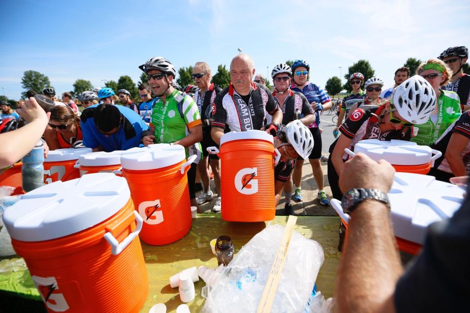 Riders stop for energy drinks and ice at the 25-mile rest stop at Pickerington North High School during Pelotonia in 2016.