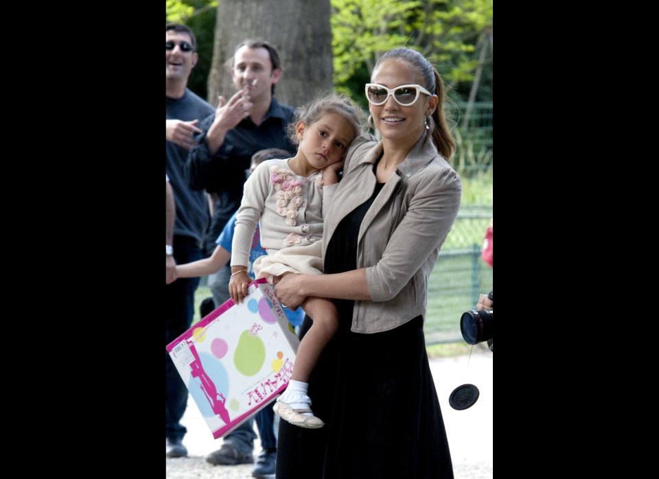 Jennifer Lopez takes her twins, Emme and Max to the Parc Monceau in Paris, France where they played on the carousel and swings.