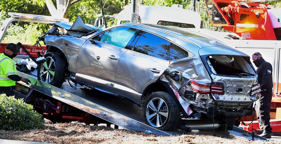 A tow truck recovers the vehicle driven by golfer Tiger Woods in Rancho Palos Verdes, California, on February 23, 2021, after a rollover accident.