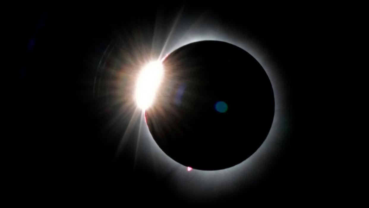 PHOTO: The moon covers most of the the sun as it approaches the total solar eclipse, as seen from the summit of Saddleback Mountain, April 8, 2024, near Rangeley, Maine.  (Robert F. Bukaty/AP)