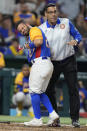 Venezuela's Jose Altuve is helped up by a trainer after he was hit by a pitch during the fifth inning of a World Baseball Classic game against the U.S., Saturday, March 18, 2023, in Miami. (AP Photo/Wilfredo Lee)