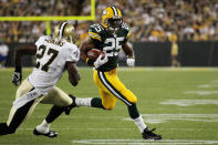 GREEN BAY, WI - SEPTEMBER 08: Ryan Grant #25 of the Green Bay Packers runs with the ball against Malcolm Jenkins #27 of the New Orleans Saints during the season opening game at Lambeau Field on September 8, 2011 in Green Bay, Wisconsin. (Photo by Jonathan Daniel/Getty Images)