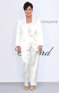 Kris keeps things classic in her sleek white Tommy x Zendaya suit and gold sandals at the amfAR Gala.