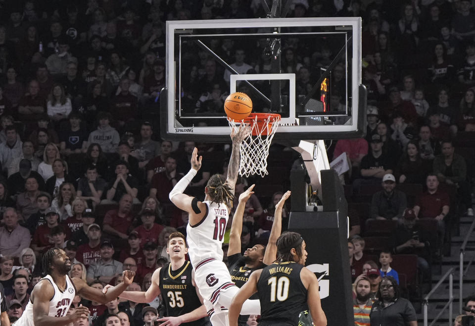 South Carolina guard Myles Stute (10) shoots the ball over Vanderbilt forward Carter Lang (35) during the first half of an NCAA college basketball game Saturday, Feb. 10, 2024, in Columbia, S.C. (AP Photo/David Yeazell)