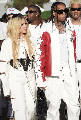 <p>Tim Regas / MEGA</p> Avril Lavigne and Tyga on July 4, 2023