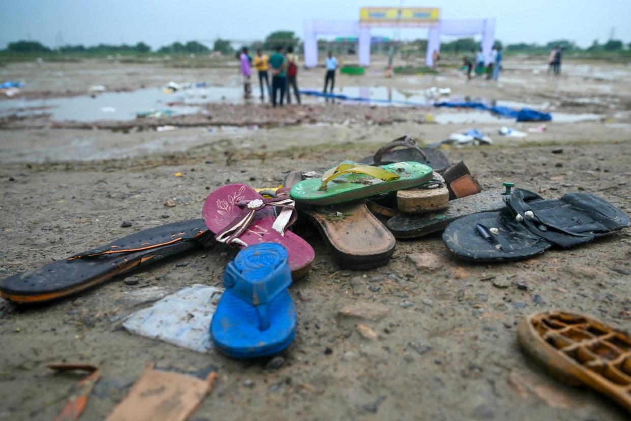 <span>Shoes on the ground at the scene where a crowd crush killed people during a sermon at Hathras in India's Uttar Pradesh state.</span><span>Photograph: Arun Sankar/AFP/Getty</span>