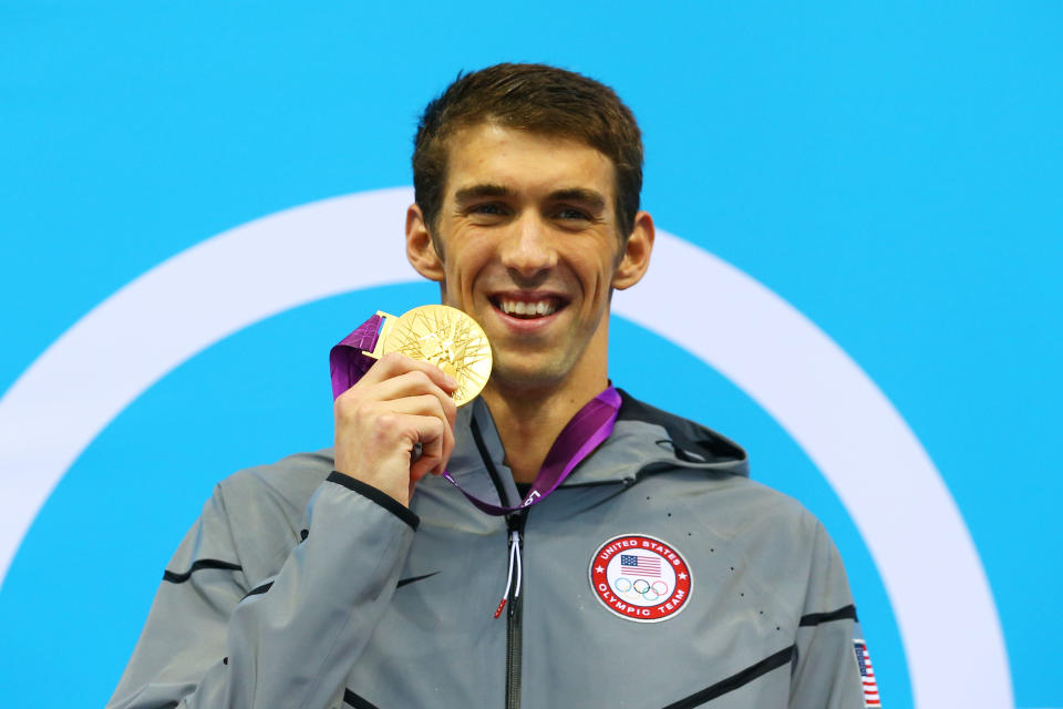 Gold medalist <a href="http://sports.yahoo.com/olympics/swimming/michael-phelps-1131796/" data-ylk="slk:Michael Phelps;elm:context_link;itc:0;sec:content-canvas" class="link ">Michael Phelps</a> of the United States poses on the podium during the medal ceremony for the Men's 100m Butterfly Final on Day 7 of the London 2012 Olympic Games at the Aquatics Centre on August 3, 2012 in London, England. (Photo by Al Bello/Getty Images)