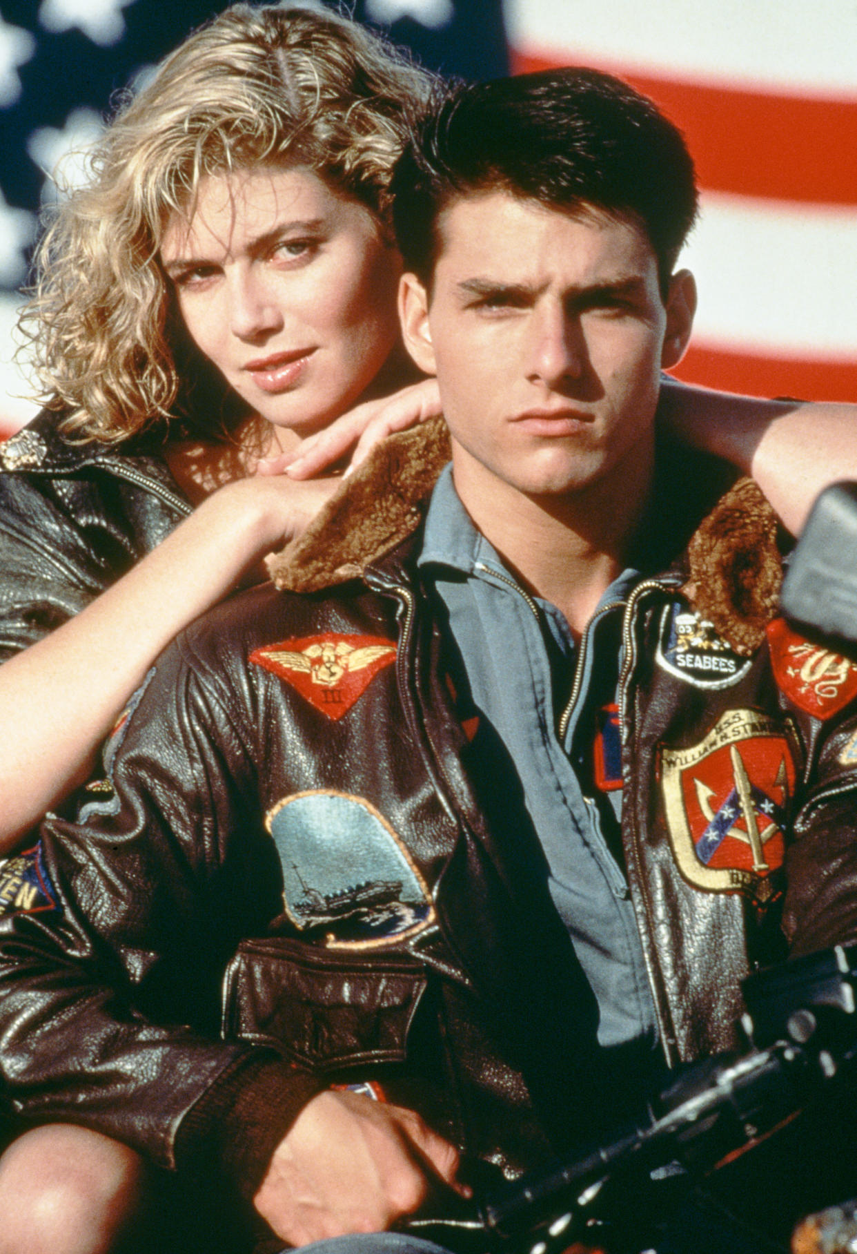 American actors Tom Cruise, as Lieutenant Pete 'Maverick' Mitchell, and Kelly McGillis, as Charlotte 'Charlie' Blackwood, in a promotional portrait for 'Top Gun', directed by Tony Scott, 1986. (Photo by Paramount Pictures/Archive Photos/Getty Images)