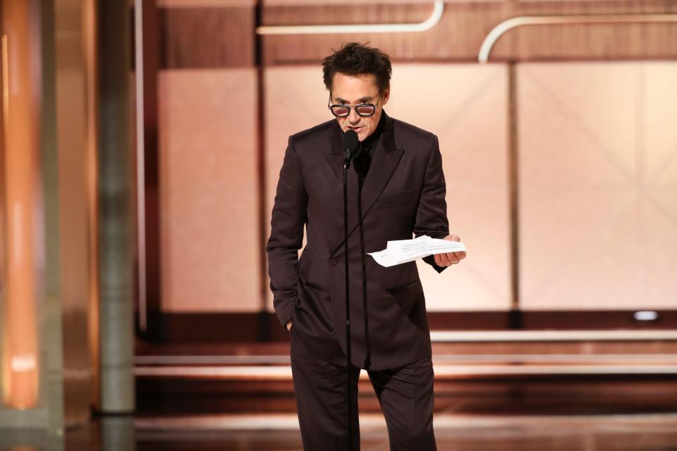 Robert Downey Jr. accepts the award for best performance by a male actor in a supporting role in any motion picture for his role as Lewis Strauss in "Oppenheimer."