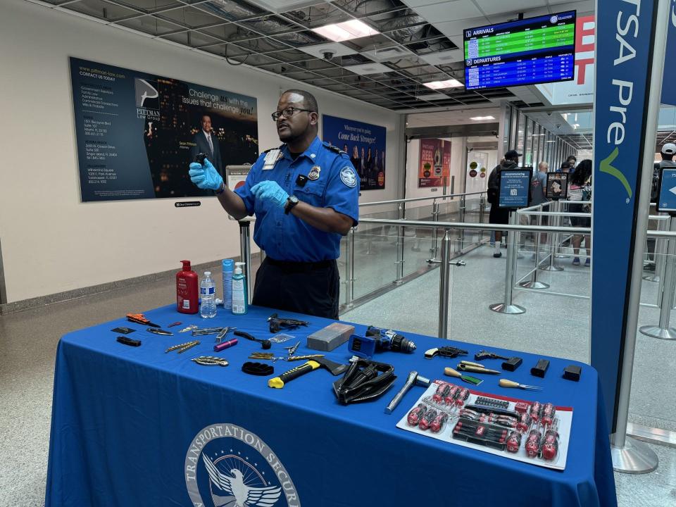 Lead Transportation Security Office of Tallahassee International Airport Cedric Williams holds a torch lighter as he gives a presentation of prohibited items passengers have voluntarily abandoned.
