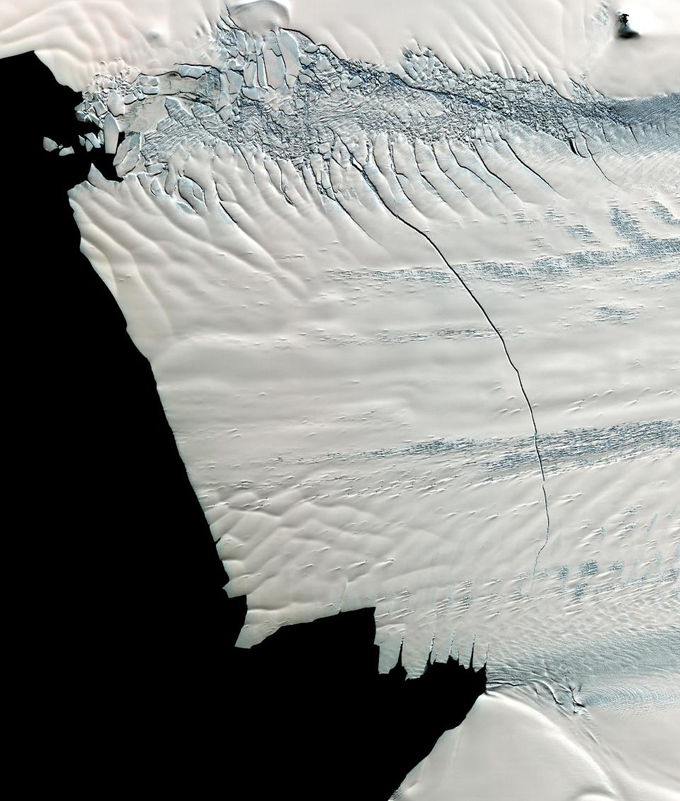 In mid-October 2011, NASA scientists working in Antarctica discovered a massive crack across the Pine Island Glacier, a major ice stream that drains the West Antarctic Ice Sheet. Extending for 19 miles, the crack was 260 feet wide and 195 feet deep. Eventually, the crack will extend all the way across the glacier, and calve a giant iceberg that will cover about 350 square miles. This image from the ASTER instrument on NAS's Terra spacecraft was acquired Nov. 13, 2011 and covers an area of 27 by 32 miles , and is located near 74.9 degrees south latitude, 101.1 degrees west longitude.