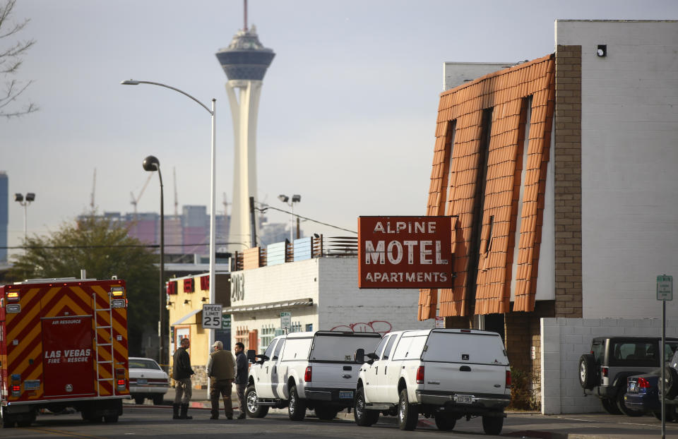 Las Vegas firefighters work the scene of a fire at a three-story apartment complex early Saturday, Dec. 21, 2019 in Las Vegas. The fire was in first-floor unit of the Alpine Motel Apartments and its cause was under investigation, the department said. Authorities say multiple fatalities were reported and several were injured. (Chase Stevens /Las Vegas Review-Journal via AP)