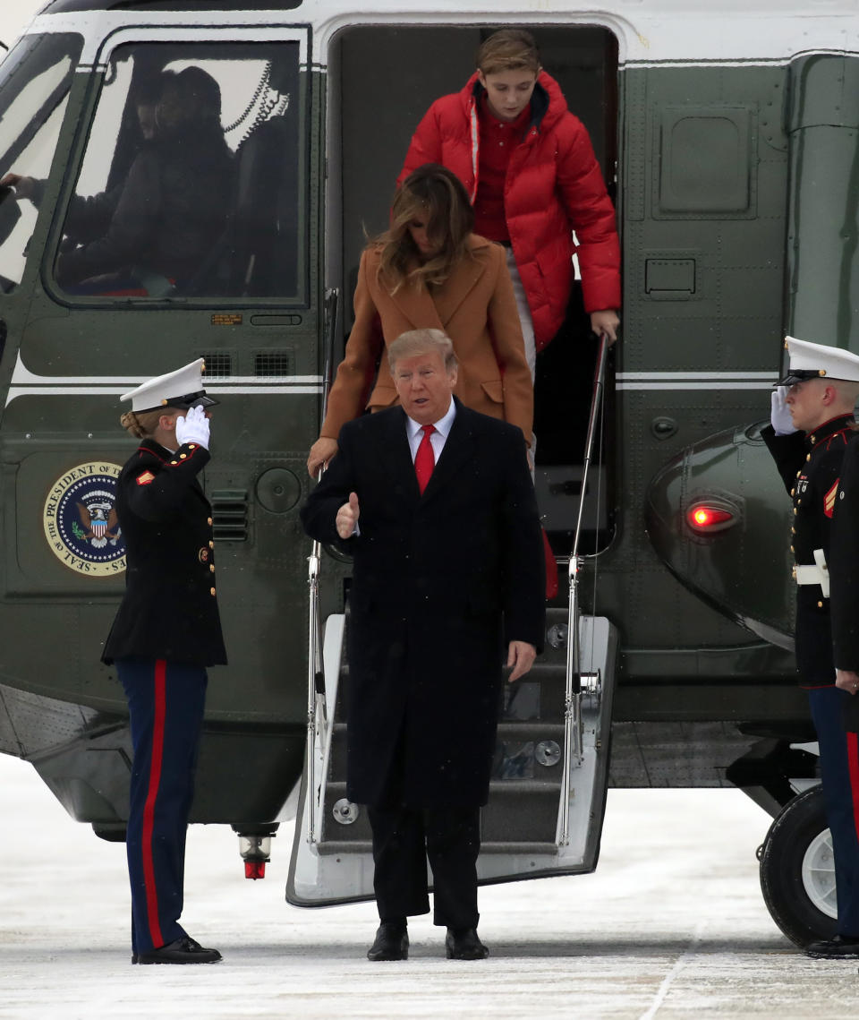 President Donald Trump walks with his wife first lady Melania Trump and their son Barron Trump on the tarmac of Andrews Air Force Base, Md., to switch from Marine One to Air Force One that will take the first family for the weekend at his Mar-a-Lago estate in Palm Beach, Fla., Friday, Feb. 1, 2019. (AP Photo/Manuel Balce Ceneta)