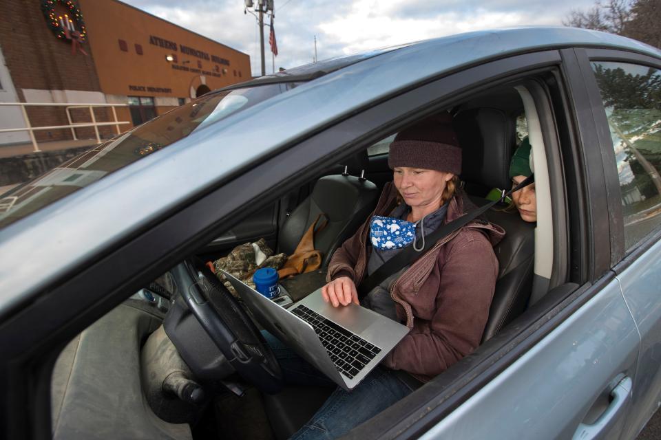 After picking up two of her kids at school, Kat Becker fires up her laptop with her son, Ted, looking over her shoulder in downtown Athens. Because internet service is slow and cell service is spotty, Becker will park downtown and from her car use Wi-Fi from the public library or a funeral home. But from 2019, the year Evers took office, to early 2022, Wisconsin had allocated nearly $60 million for broadband, also known as high-speed internet, aimed at tens of thousands of households and businesses.