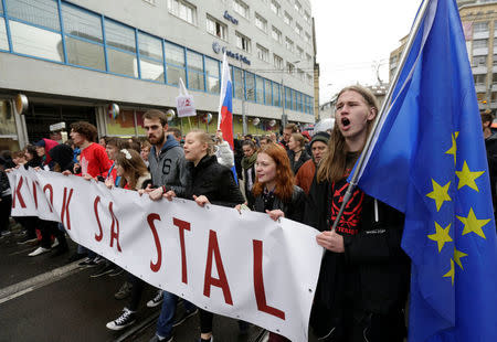 Demonstrators hold banners during an anti-corruption rally demanding the resignation of the interior minister and police chief in Bratislava, Slovakia, April 18, 2017. REUTERS/David W Cerny