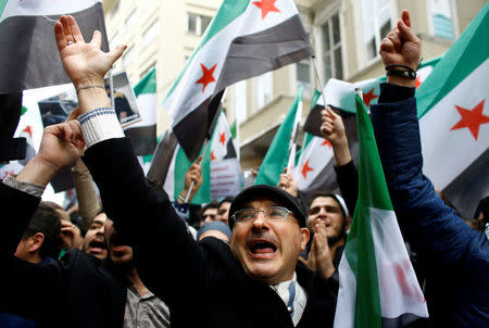 Syrians living in Istanbul gather in front of the Russian Consulate during a protest in Istanbul, Turkey February 22, 2018. REUTERS/Osman Orsal