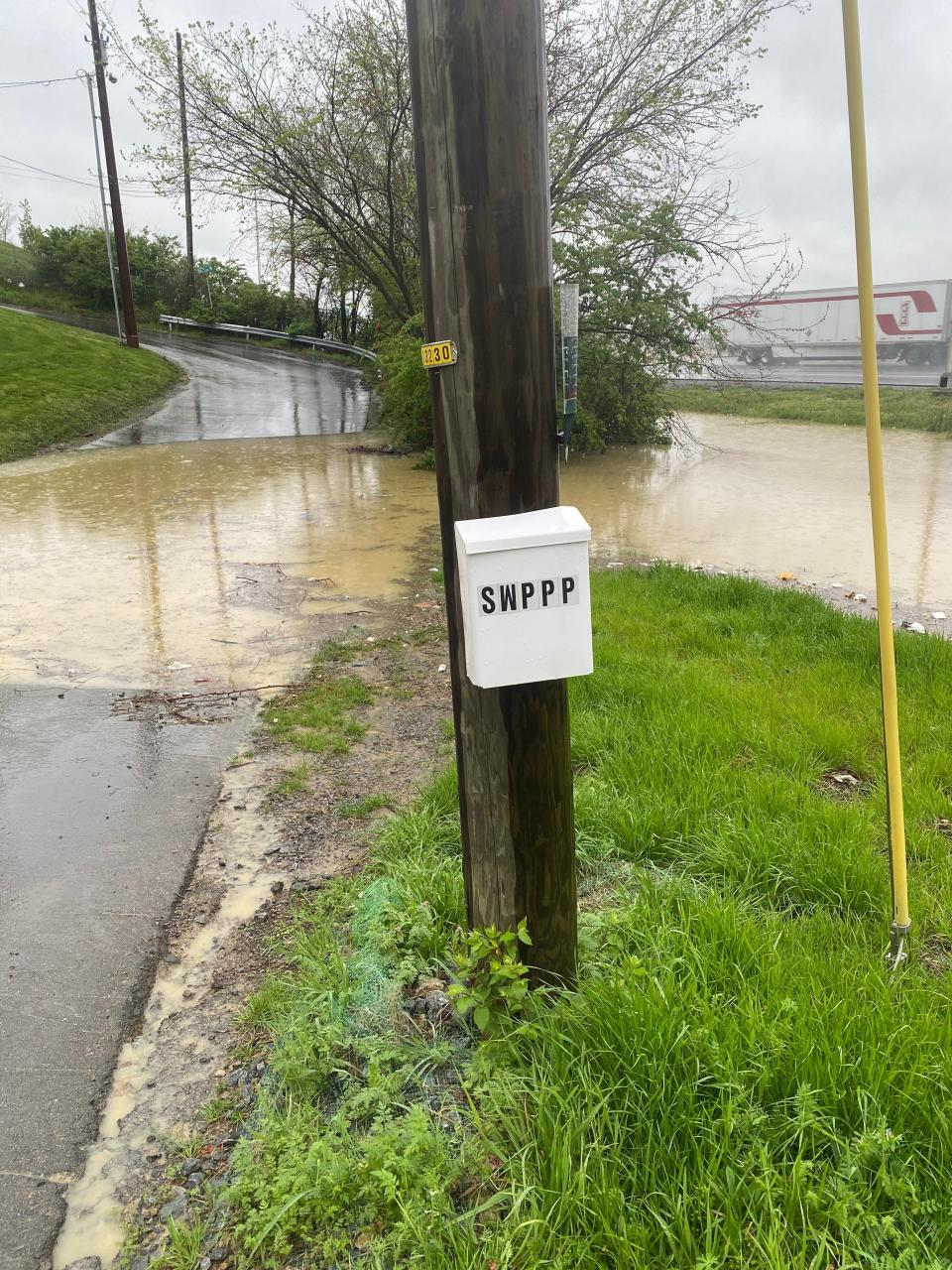 Muddy runoff pools on Delaware Avenue, downhill of the Sky Nashville development in Sylvan Heights in April 2023.