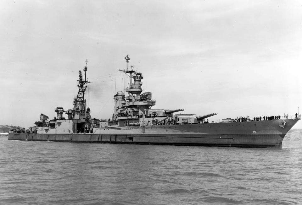 FILE - In this July 10, 1945, photo provided by U.S. Navy, the USS Indianapolis (CA 35) is shown off the Mare Island Navy Yard, in Vallejo, Calif. The U.S. Navy on Friday, May 27, 2022, said it has changed the status of 13 sailors who were lost when Japanese torpedoes sank the USS Indianapolis July 30, 1945. There were only 316 survivors among the ship's crew of 1,195 sailors. About 300 went down with the ship and about 900 men were set adrift. (U.S. Navy via AP)