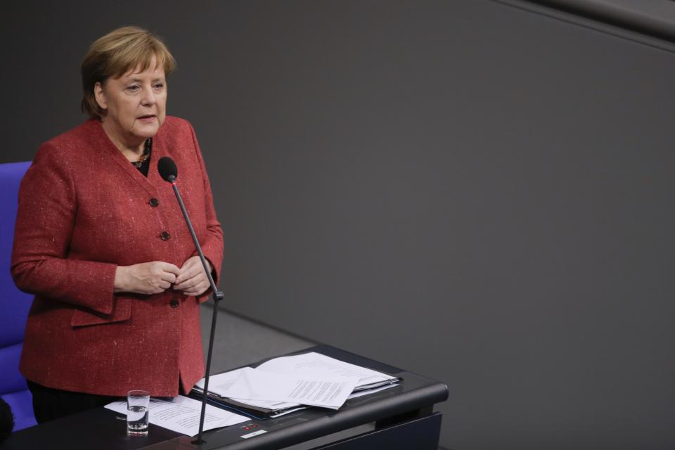 German Chancellor Angela Merkel answers questions of lawmakers during a parliament session of the Bundestag in Berlin, Wednesday, Dec. 12, 2018. (AP Photo/Markus Schreiber)