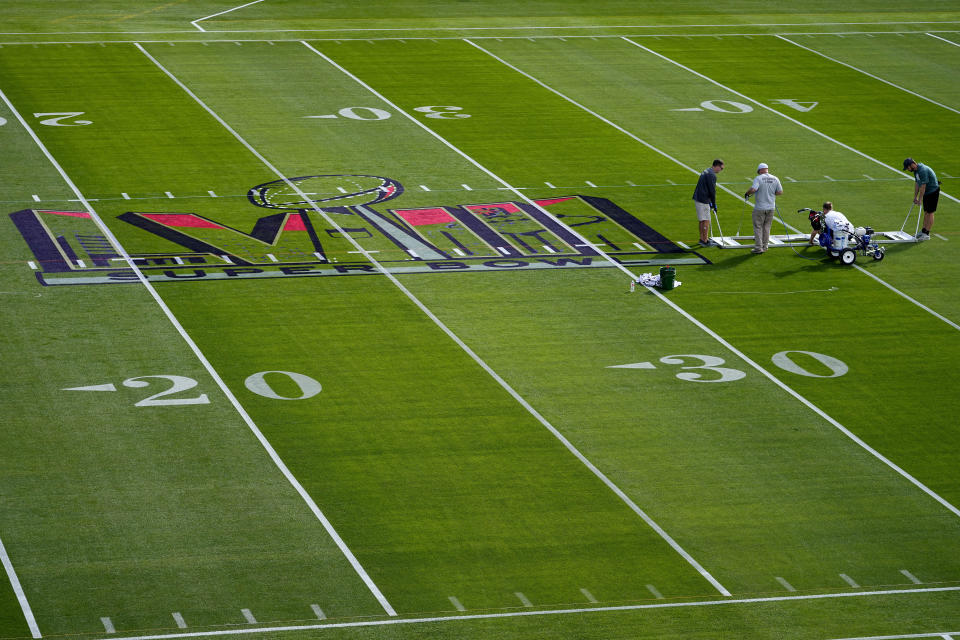 Workers prepare the field outside Allegiant Stadium ahead of Super Bowl 58, Wednesday, Jan. 31, 2024, in Las Vegas. (AP Photo/Matt York)