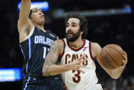 Cleveland Cavaliers' Ricky Rubio (3) drives against Orlando Magic's R.J. Hampton (13) in the second half of an NBA basketball game, Saturday, Nov. 27, 2021, in Cleveland. The Cavaliers won 105-92. (AP Photo/Tony Dejak)