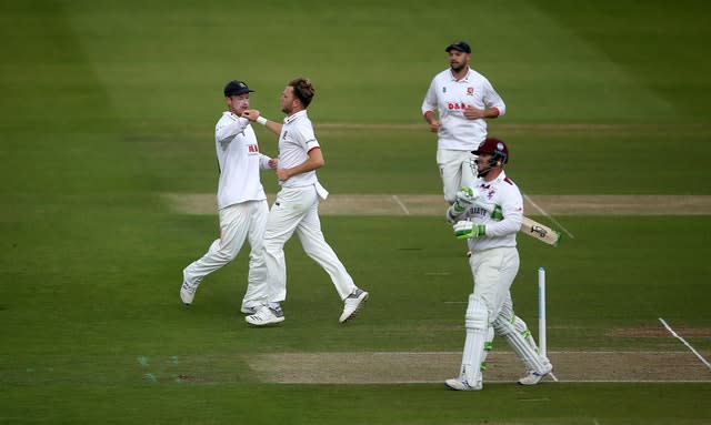 Essex paceman Sam Cook (centre) claimed a five-wicket haul