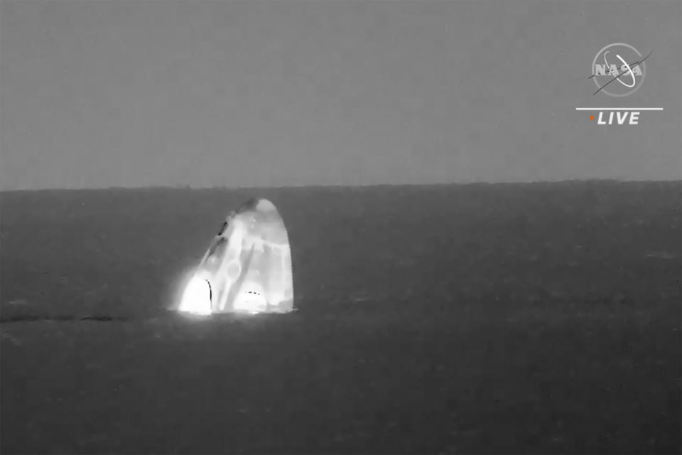 In this image made from video supplied by NASA, SpaceX Dragon space capsule splashes down in the Gulf of Mexico early Friday, May 6, 2022. NASA’s Raja Chari, Tom Marshburn and Kayla Barron, and the European Space Agency’s Matthias Maurer undocked from the International Space Station less than 24 hours earlier. (NASA via AP)