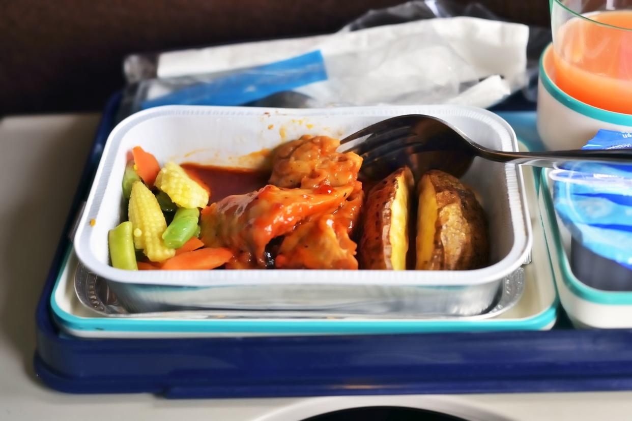 mixed vegetable protein airplane meal in plastic dishes