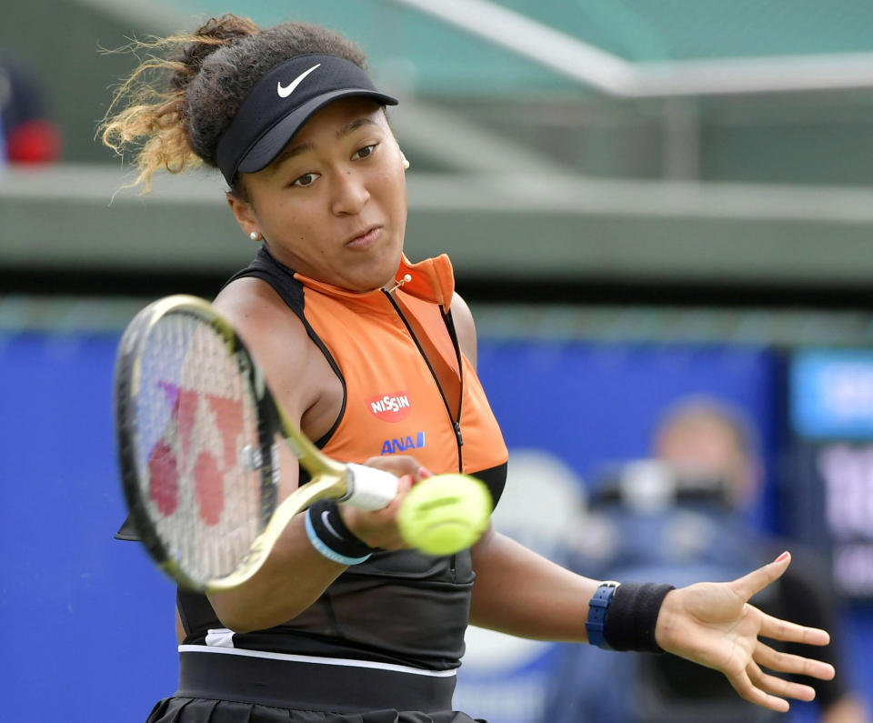 Japan's Naomi Osaka makes a forehand return to Russia's Anastasia Pavlyuchenkova during their final match at the Toray Pan Pacific Open tennis tournament in Osaka, western Japan, Sunday, Sept. 22, 2019. Osaka won her first singles title since the Australian Open in January by beating Pavlyuchenkova 6-2, 6-3 in the final. (Kyodo News via AP)